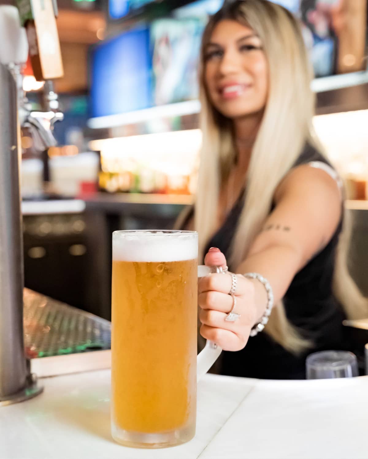Barmaid serving beer